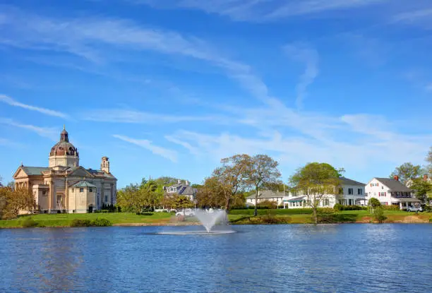 A large body of water with buildings in the background.