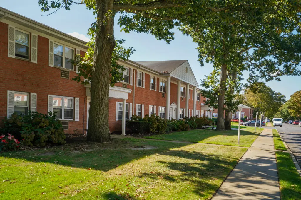 A row of houses on the side of a street.