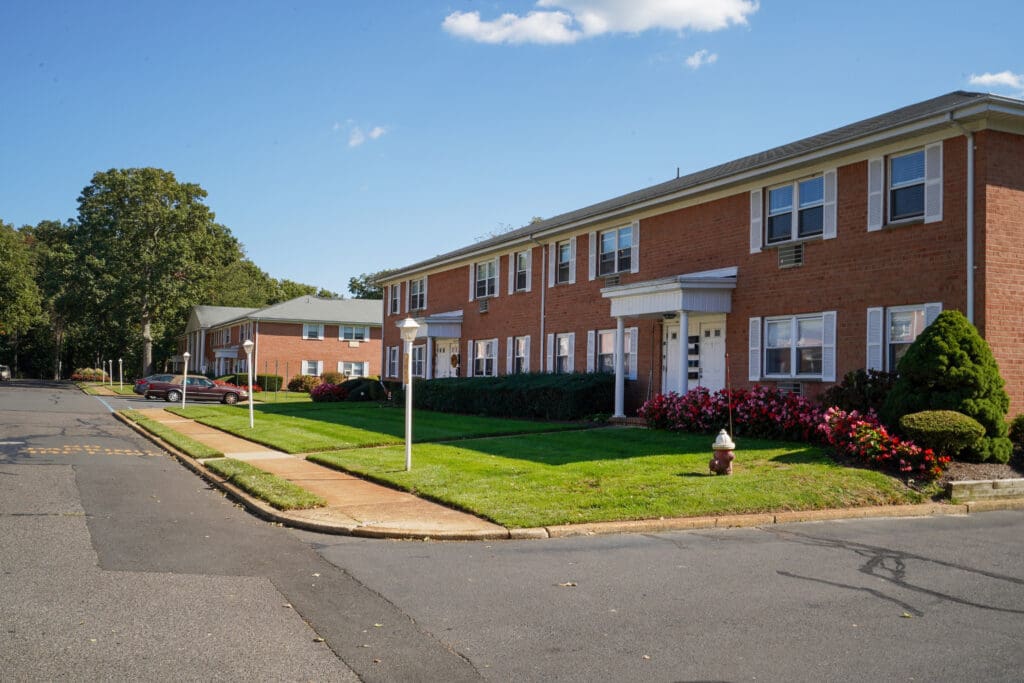 A row of houses on the side of a street.