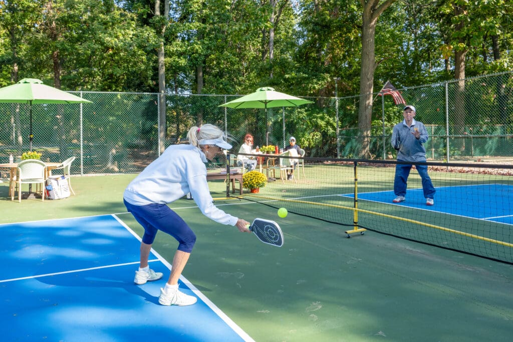 A woman is playing tennis on the court